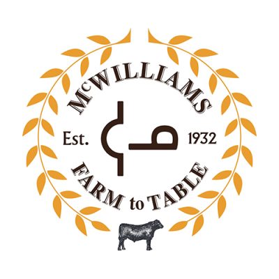 McWilliams Farm to Table brand mark — Est. 1932, a wheat wreath and an Angus steer
